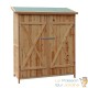 Grande cabane de jardin en bois pour le rangement des outils et le stockage des objets de jardin.