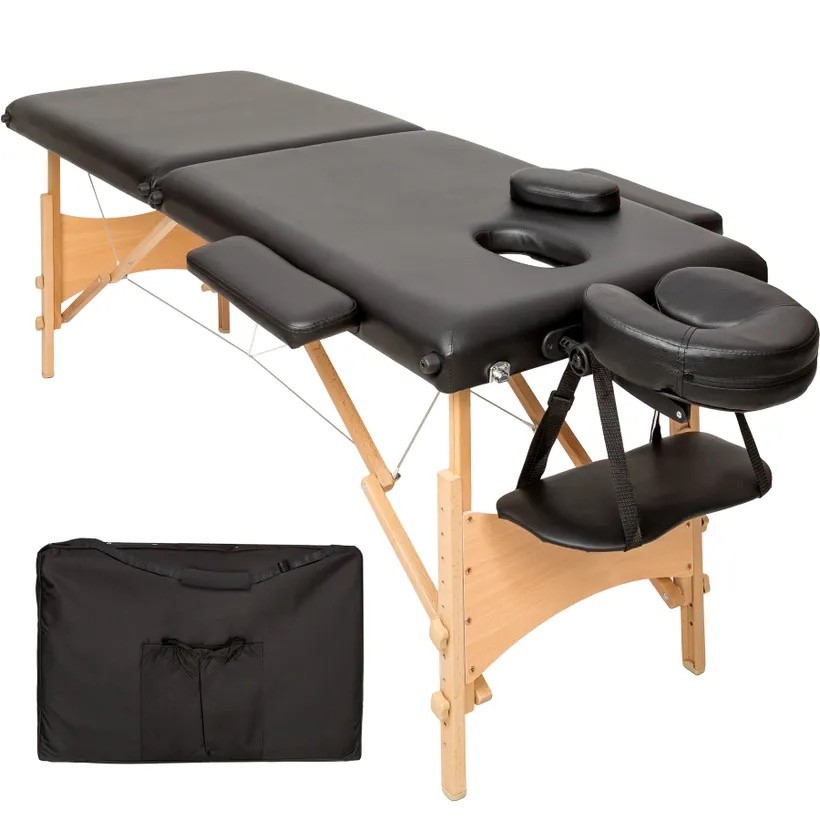 Table de massage noire pliable en bois avec réglage de hauteur et accoudoirs.